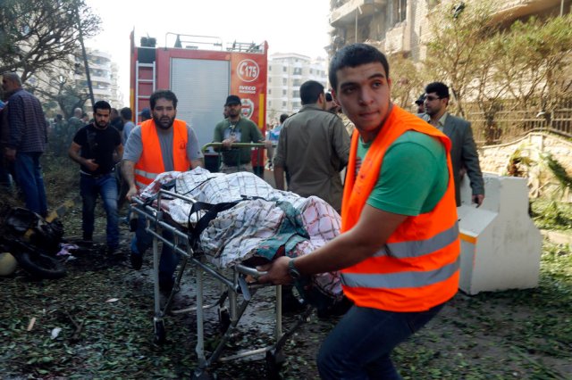 Medics transport a body at the site of explosions near the Iranian embassy in Beirut